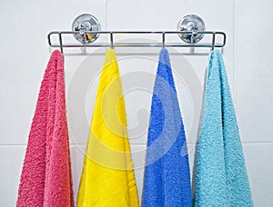 Colorful towels hanging in a bathroom