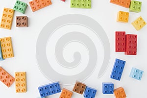 Colorful toy bricks on white background