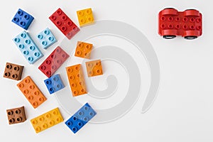 Colorful toy bricks on white background