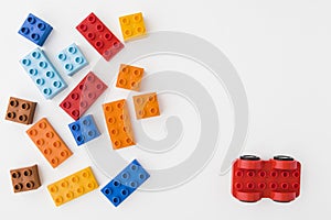Colorful toy bricks on white background