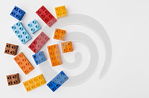 Colorful toy bricks on white background