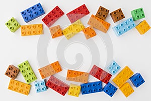 Colorful toy bricks on white background