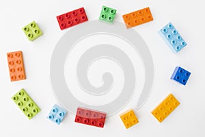 Colorful toy bricks on white background