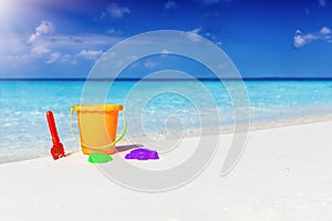 Colorful toys on a tropical beach