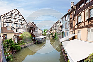 Colorful traditional french houses on the side of river Lauch in