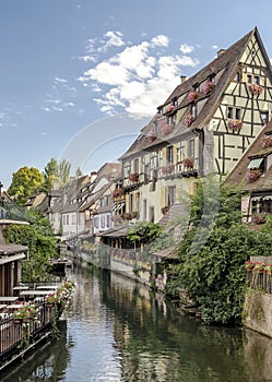 Colorful traditional french houses on the side of river Lauch in Petite Venise, Colmar, France