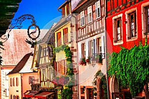 Colorful traditional half-timbered houses of Alsace in France, R