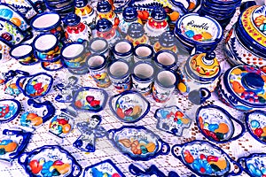 Colorful traditional Mexican pottery. Talavera style. Souvenirs on sale in local market of Puebla, Mexico