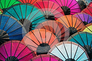 Colorful traditional paper umbrellas on market. Laos, Luang Prabang