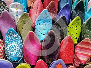 Colorful traditional slippers or shoes at a Moroccan bazaar in Marrakech.