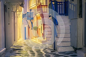 Colorful traditional street on Mykonos island at night, Cyclades, Greece