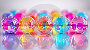 Colorful, translucent marbles arranged in a playful pattern reflecting light on a surface