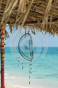 Colorful travel and vacation concept. Dream captcher on a beach background. Lovely and paceful picture.