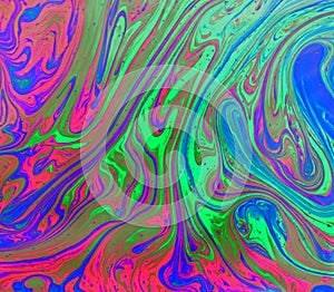 Colorful, trippy green, blue and pink psychedelic abstract background