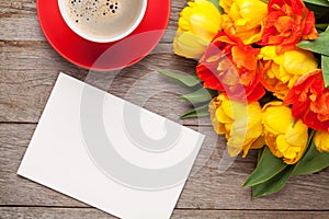 Colorful tulips, greeting card and coffee cup