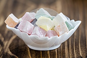 Colorful Turkish Delight on Wooden Background