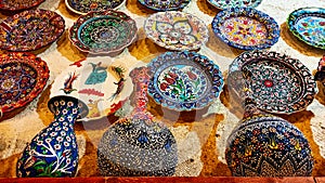 Colorful Turkish traditional ceramic handycrafts in a local pottery shop in Cappadocia photo