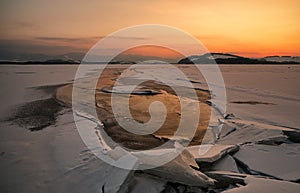 Colorful twilight over frozen lake