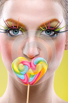 Colorful twisted lollipop and colorful fashion makeup