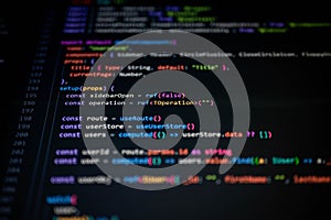 Colorful TypeScript code on dark screen showing function setup with refs, route, and computed values, representing
