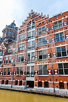 Colorful typical dutch building and Saint Nicholas Church