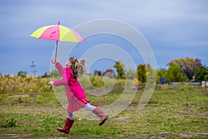 Colorful umbrella cute girl jump funny to sky