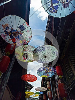 The colorful umbrella decoration over the alleys of the ancient city.