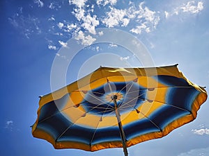 Colorful umbrella on a Ligurian beach photo