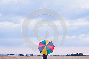 Colorful umbrella, multicolored background, happiness concept