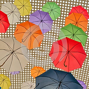 Colorful umbrellas as decoration on the ceiling of a house