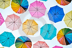 Colorful umbrellas background. Colorful umbrellas hanging in the sky used as street decoration