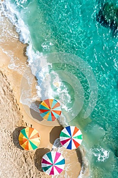 Colorful umbrellas on the beach. Generative AI