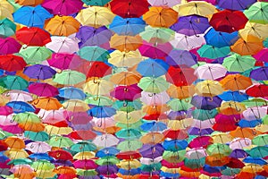 Colorful umbrellas decorating a street in agueda photo