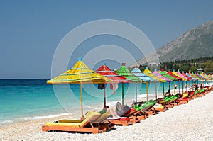 Colorful umbrellas at Dhermi beach. Vlore county. Albania