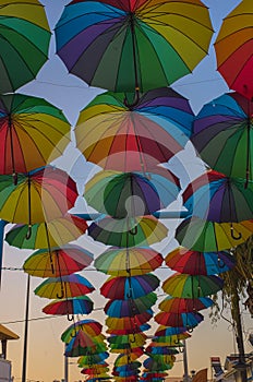 Colorful umbrellas hanged by a summer day in the city of Didim, Turkey