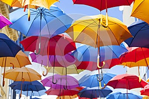 Colorful umbrellas hanging in the air