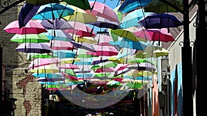 Colorful umbrellas hanging in the famous Orange Street Alley