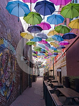 Colorful umbrellas hanging in the famous Orange Street Alley