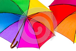 Colorful umbrellas. Rainbow colors. Protection against rain. Open umbrellas under the roof.