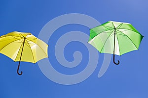 Colorful umbrellas in the sky on blue background