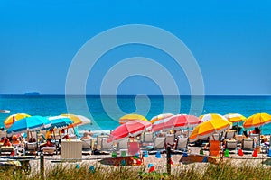 Colorful umbrellas on south beach in Miami Florida. photo