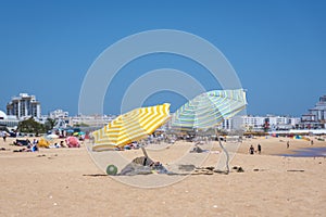 Colorful umbrellas on Vilamoura beach photo