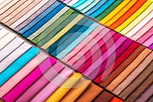 Colorful upholstery fabric samples. Multicolor Texture background