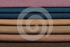 Colorful upholstery fabric samples background.
