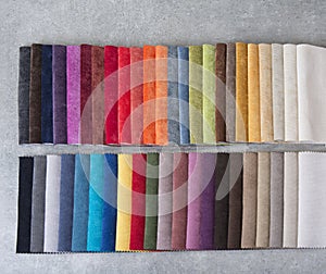 Colorful upholstery fabric samples in the store.