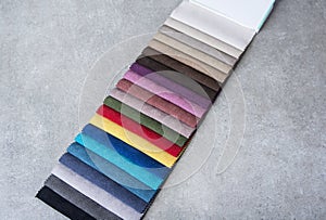 Colorful upholstery fabric samples in the store.