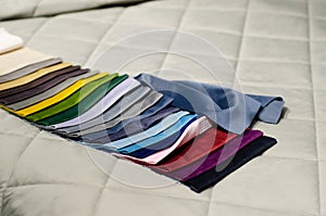 Colorful upholstery fabric samples in the store. Types Of Fabrics