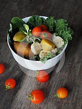 colorful vegetable salad on wood table