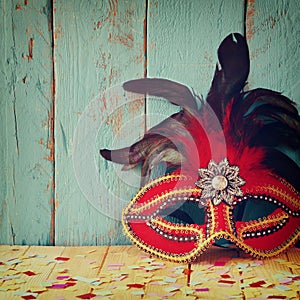 Colorful Venetian masquerade mask. selective focus. vintage filtered