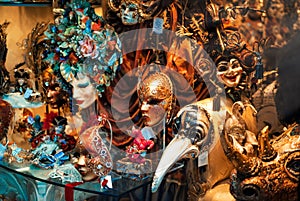 Colorful venetian masquerade masks in shop window in Venice, Italy. Traditional part of famous festival Venetian carnival and